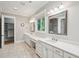 Elegant bathroom featuring double vanities, a walk-in shower, and spacious layout at 1510 Old Rosebud Trl, Awendaw, SC 29429
