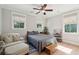 Comfortable bedroom with large windows providing natural light and calming views of the outdoors at 1510 Old Rosebud Trl, Awendaw, SC 29429