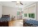 Charming bedroom with hardwood floors, twin beds and bright windows at 1510 Old Rosebud Trl, Awendaw, SC 29429