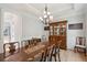 Spacious dining room with hardwood floors, chandelier, wood table, and a china cabinet at 1510 Old Rosebud Trl, Awendaw, SC 29429