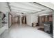 Spacious garage interior featuring custom storage solutions, epoxy flooring, and ample lighting at 1510 Old Rosebud Trl, Awendaw, SC 29429