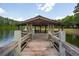 Charming gazebo on the water's edge, offering picturesque views of a fountain and lush scenery, creating a peaceful retreat at 1510 Old Rosebud Trl, Awendaw, SC 29429