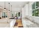 Large kitchen with an expansive center island, stainless steel appliances, and views of the outdoors at 1510 Old Rosebud Trl, Awendaw, SC 29429