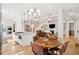 Bright, open-concept kitchen featuring a central island, stainless steel appliances, and a seamless flow into the living area at 1510 Old Rosebud Trl, Awendaw, SC 29429