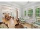 Living room showing interior architecture with entry to dining room and large windows at 1510 Old Rosebud Trl, Awendaw, SC 29429