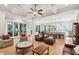 Bright, open-concept living room featuring hardwood floors and access to a back deck and gourmet kitchen at 1510 Old Rosebud Trl, Awendaw, SC 29429