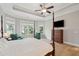 Spacious main bedroom with great natural light, hardwood floors, and tray ceiling at 1510 Old Rosebud Trl, Awendaw, SC 29429
