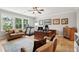 Spacious home office featuring a treadmill and a well-lit workspace at 1510 Old Rosebud Trl, Awendaw, SC 29429