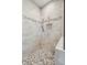 A tile shower is equipped with a built-in niche and adjustable handheld shower fixture at 1510 Old Rosebud Trl, Awendaw, SC 29429