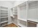 Bright and airy walk-in closet with ample shelving and hanging storage at 1510 Old Rosebud Trl, Awendaw, SC 29429