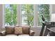 Window view overlooking a tree lined river from a comfortable leather couch at 1510 Old Rosebud Trl, Awendaw, SC 29429