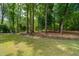 Lush green yard with beautiful mature trees at 1510 Old Rosebud Trl, Awendaw, SC 29429