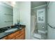 Well-lit bathroom with granite countertops, wood cabinets, and a tub/shower combination at 1512 Eagle Landing Blvd, Hanahan, SC 29410