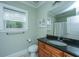 Well-lit bathroom featuring a granite countertop, tiled floors, and natural light from the window at 1512 Eagle Landing Blvd, Hanahan, SC 29410