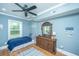 Bedroom with hardwood floors, a ceiling fan, and a dresser with a vanity mirror at 1512 Eagle Landing Blvd, Hanahan, SC 29410