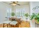 Bright breakfast nook with a dark wood table, cushioned seating, and plenty of natural light from the windows at 1512 Eagle Landing Blvd, Hanahan, SC 29410