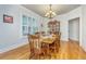 Formal dining room featuring a classic wood table, matching chairs, and window shutters at 1512 Eagle Landing Blvd, Hanahan, SC 29410