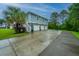 Beautiful two-story home with a three-car garage and a long driveway at 1512 Eagle Landing Blvd, Hanahan, SC 29410