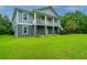 Charming two-story home with a well-manicured lawn and an appealing coastal design at 1512 Eagle Landing Blvd, Hanahan, SC 29410