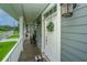 Charming front porch with a decorative wreath and inviting outdoor lanterns at 1512 Eagle Landing Blvd, Hanahan, SC 29410