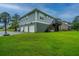 Spacious three-car garage with a basketball hoop and a lush green lawn at 1512 Eagle Landing Blvd, Hanahan, SC 29410