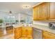 Warm, inviting kitchen featuring granite countertops and light wood cabinetry at 1512 Eagle Landing Blvd, Hanahan, SC 29410