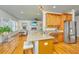 Open kitchen with granite countertops seamlessly connecting to the living room at 1512 Eagle Landing Blvd, Hanahan, SC 29410