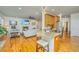 Kitchen island with barstool seating open to the living room with fireplace at 1512 Eagle Landing Blvd, Hanahan, SC 29410