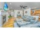Spacious living room featuring a fireplace, plush sofas, and seamless access to kitchen at 1512 Eagle Landing Blvd, Hanahan, SC 29410