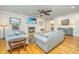 Inviting living room featuring plush seating, fireplace, and hardwood floors at 1512 Eagle Landing Blvd, Hanahan, SC 29410
