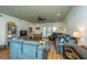 Open-concept living room with hardwood floors, comfortable seating, and access to the outdoors at 1512 Eagle Landing Blvd, Hanahan, SC 29410