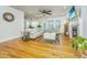 Bright and airy living room with hardwood floors, comfortable seating, and a cozy fireplace at 1512 Eagle Landing Blvd, Hanahan, SC 29410