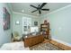 Home office with hardwood floors, a ceiling fan, and shelving with a variety of books at 1512 Eagle Landing Blvd, Hanahan, SC 29410
