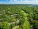 A view of community homes interspersed with a golf course and lush trees with green and sand traps at 153 High Hammock Villas, Seabrook Island, SC 29455