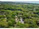 Scenic aerial view showcases a community nestled amid lush greenery and the ocean in the background at 153 High Hammock Villas, Seabrook Island, SC 29455
