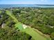 An aerial view that showcases a golf course community, situated near the ocean and offering a picturesque living environment at 153 High Hammock Villas, Seabrook Island, SC 29455