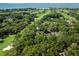 An aerial shot shows the community nestled by the golf course and lagoons, offering scenic waterfront views at 153 High Hammock Villas, Seabrook Island, SC 29455