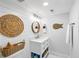 Charming bathroom featuring a white vanity, round mirror, and coastal-themed decor accents at 153 High Hammock Villas, Seabrook Island, SC 29455