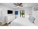 Bedroom with a view, ample light, and a large dresser featuring a comfortable bed and hardwood flooring at 153 High Hammock Villas, Seabrook Island, SC 29455