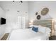 Bedroom featuring a comfortable bed, hardwood flooring, modern decor, and vaulted ceilings at 153 High Hammock Villas, Seabrook Island, SC 29455