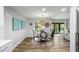 Bright dining area featuring stylish decor, round table with seating for four, and an inviting view of the outdoors at 153 High Hammock Villas, Seabrook Island, SC 29455