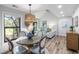 Inviting dining area features a large table, stylish seating, and serene outdoor views at 153 High Hammock Villas, Seabrook Island, SC 29455