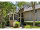 Charming two-story home featuring a landscaped front yard and covered entry at 153 High Hammock Villas, Seabrook Island, SC 29455
