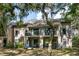 Exterior of a multi-story home featuring balconies and green outdoor space at 153 High Hammock Villas, Seabrook Island, SC 29455