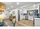 Bright kitchen features stainless steel appliances, white cabinetry, and stylish blue tile backsplash at 153 High Hammock Villas, Seabrook Island, SC 29455