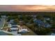 Scenic aerial view of a neighborhood with well-designed homes surrounded by lush trees, creating a peaceful and inviting community atmosphere at 1537 Tomato Farm Cir, Mount Pleasant, SC 29464