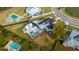Aerial shot of a beautiful property featuring a backyard pool, outdoor seating area, and lush landscaping, perfect for entertaining at 1537 Tomato Farm Cir, Mount Pleasant, SC 29464