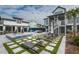 Aerial view of the home featuring a pool, multiple seating areas, outdoor kitchen, and landscaping at 1537 Tomato Farm Cir, Mount Pleasant, SC 29464