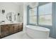 Elegant bathroom featuring a soaking tub, modern vanity, and stylish decor at 1537 Tomato Farm Cir, Mount Pleasant, SC 29464