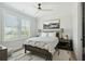 Bedroom featuring a bed, nightstands, a ceiling fan and two large windows at 1537 Tomato Farm Cir, Mount Pleasant, SC 29464